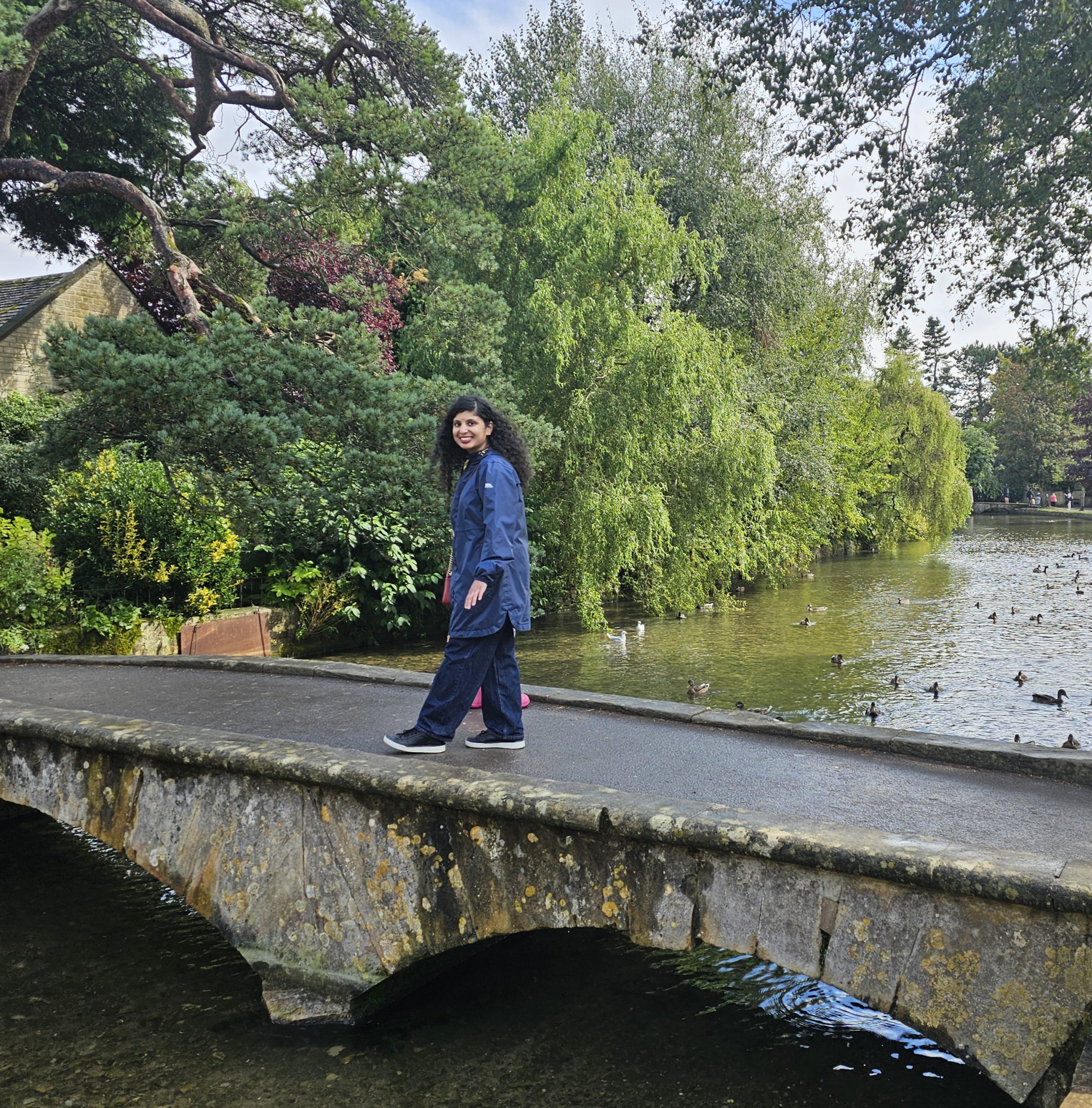 A photo of River Windrush and low stone bridge