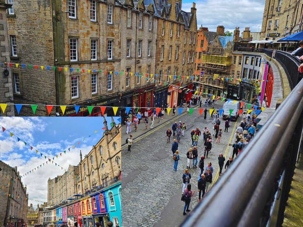 A split-view of the colourful Victoria Street in Edinburgh, showing the historic cobblestone road lined with bright, multi-coloured shop fronts and festive bunting banners under a cloudy blue sky.